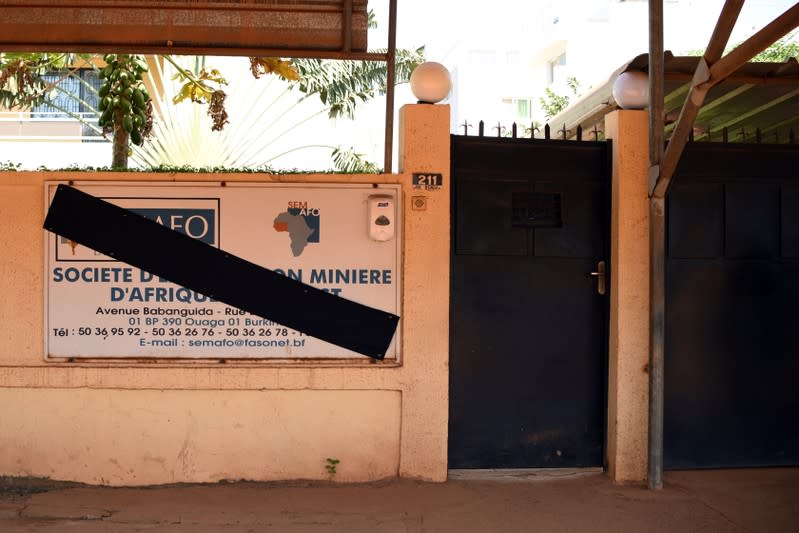 The sign of Canadian gold miner Semafo is pictured covered in black in memory of the victims of an attack on a road leading to the Boungou mine, operated by the company, at its headquarters in Ouagadougou