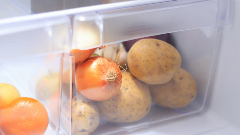 onions and potatoes in fridge