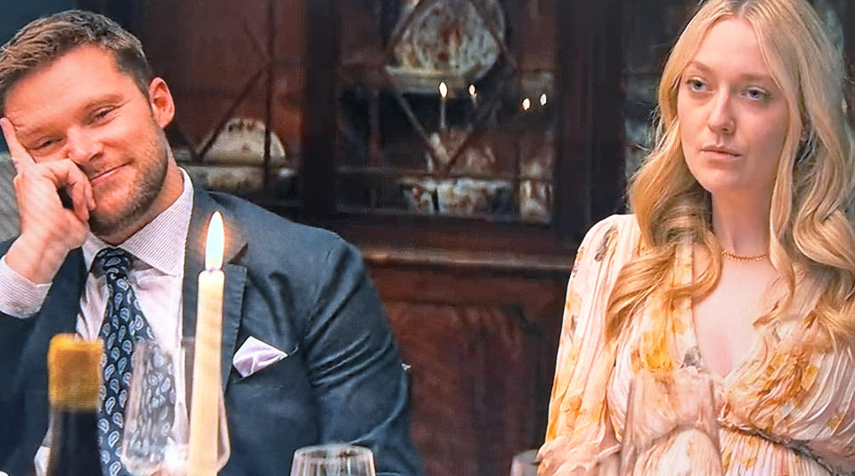 Thomas and Abby at a dinner in Netflix's "The Perfect Couple"