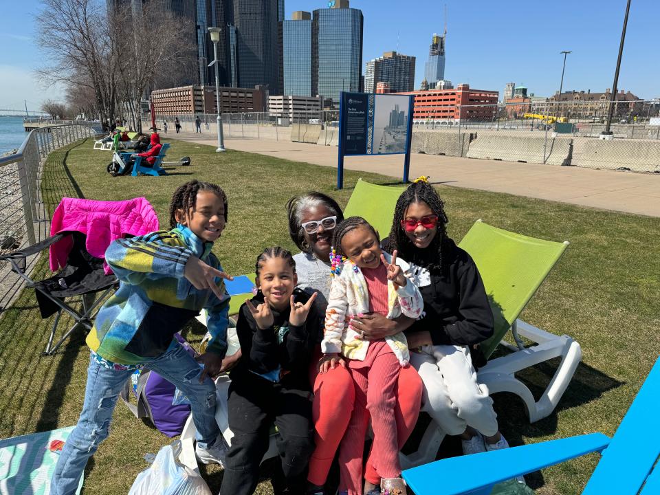 From left: Santana Jackson, 8; Jalil Jenkins, 6; Desiree Williams; Charlie Jackson, 5; Riley Jackson, 12 wait to watch the solar eclipse on April, 8, 2024 in downtown Detroit.