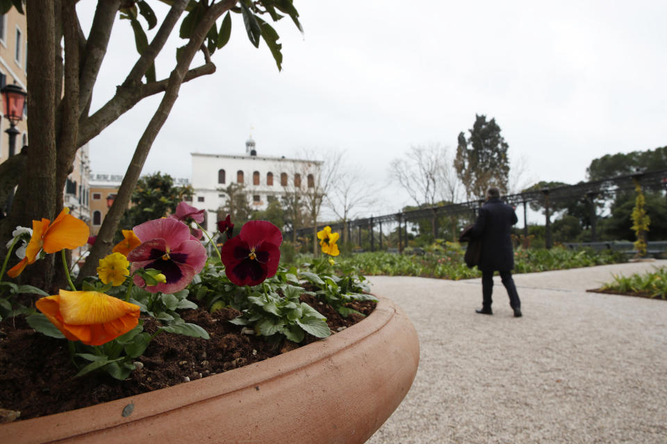 A man walks at the newly restored Royal Gardens in Venice, Italy, Tuesday, Dec. 17, 2019. Venice’s Royal Gardens were first envisioned by Napolean, flourished under Austrian Empress Sisi and were finally opened to the public by the Court of Savoy, until falling into disrepair in recent years. After an extensive restoration, the gardens reopened Tuesday as a symbol both of the lagoon city’s endurance and the necessity of public-private partnerships to care for Italy’s extensive cultural heritage. (AP Photo/Antonio Calanni)