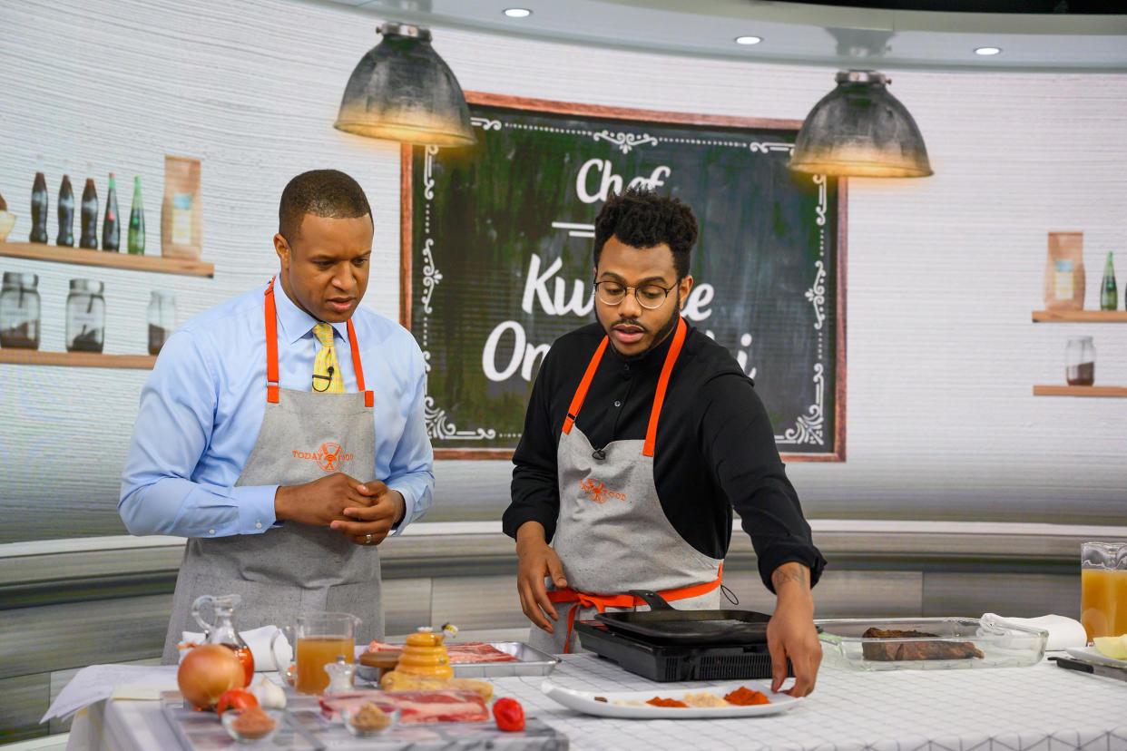 craig melvin and onwuachi stand on the set of the TODAY Show with food in front of them, cooking. (Nathan Congleton / NBC)