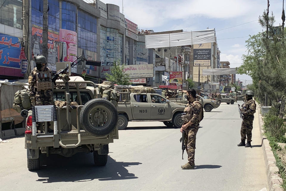 Afghan security personnel arrive at the site where gunmen attacked, in Kabul, Afghanistan, Tuesday, May 12, 2020. Gunmen stormed a hospital in the western part of the Afghan capital on Tuesday, setting off a gun battle with the police, officials said. (AP Photo/Rahmat Gul)