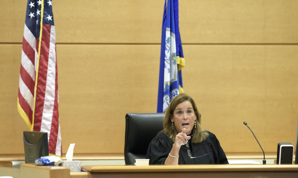 Superior Court Judge Barbara Bellis speaks with the attorneys during the Alex Jones Sandy Hook defamation damages trial in Superior Court in Waterbury, Conn., on Thursday, Oct. 2022. (H John Voorhees III/Hearst Connecticut Media via AP, Pool)