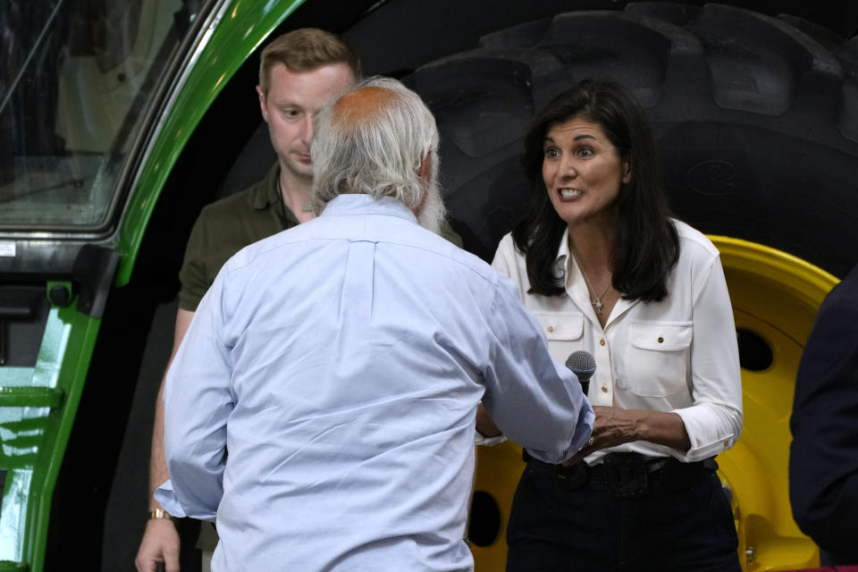 Republican presidential candidate and former U.N. Ambassador Nikki Haley greets an audience member before speaking at U.S. Sen. Joni Ernst's Roast and Ride, Saturday, June 3, 2023, in Des Moines, Iowa. (AP Photo/Charlie Neibergall)
