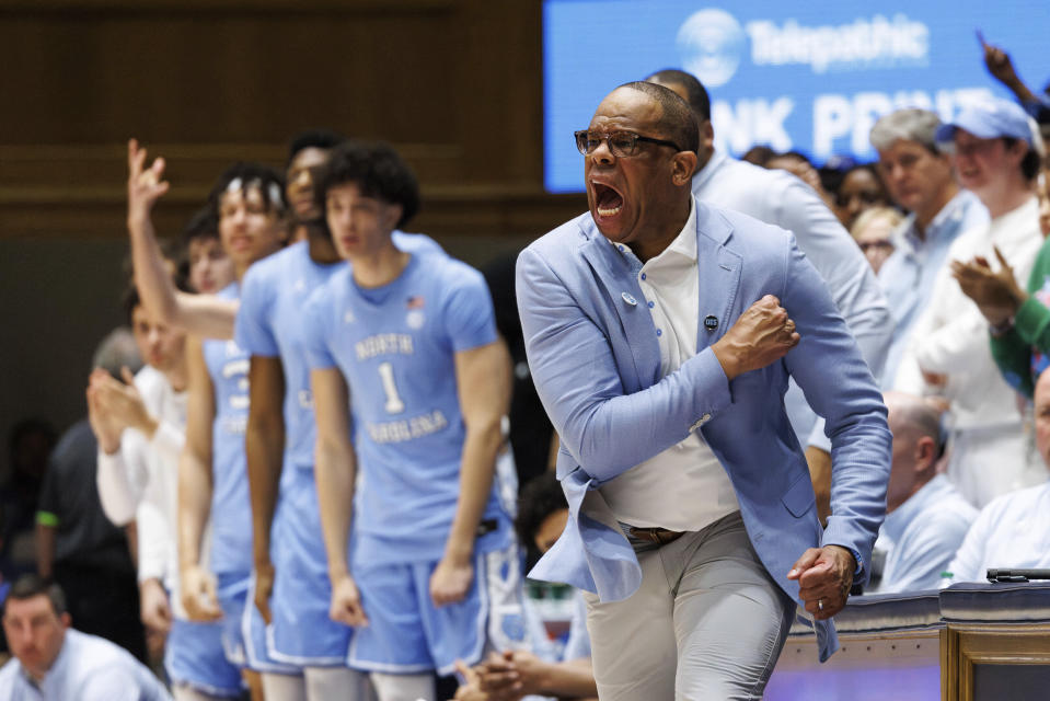 North Carolina head coach Hubert Davis shouts towards the court during the second half of an NCAA college basketball game against Duke in Durham, N.C., Saturday, March. 9, 2024. (AP Photo/Ben McKeown)