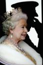 <p>The queen looked out the window as she rode in a carriage to the opening of Parliament in London.</p>