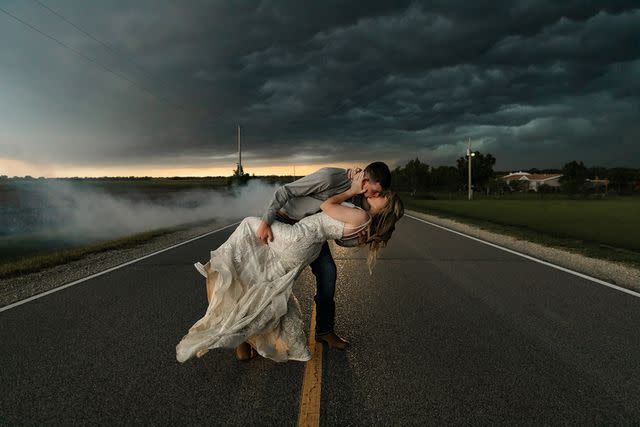 <p>Ashley Patton Photography LLC, midwest</p> Newlyweds Trapper and MaKayla Shore pose for photos as a storm looms