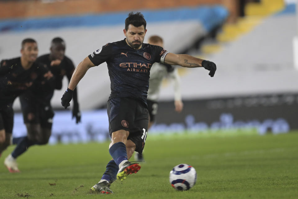 Manchester City's Sergio Aguero scores his side's third goal from a penalty kick during an English Premier League soccer match between Fulham and Manchester City at the Craven Cottage stadium in London, England, Saturday March 13, 2021. (Adam Davy/Pool via AP)