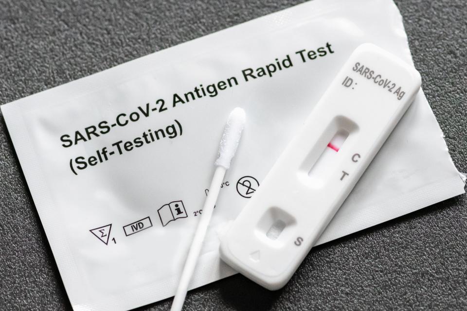 A COVID-19 test kit shows a negative result.