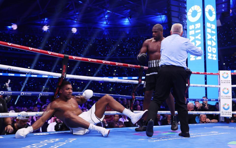 Anthony Joshua is knocked down in round three by Daniel Dubois