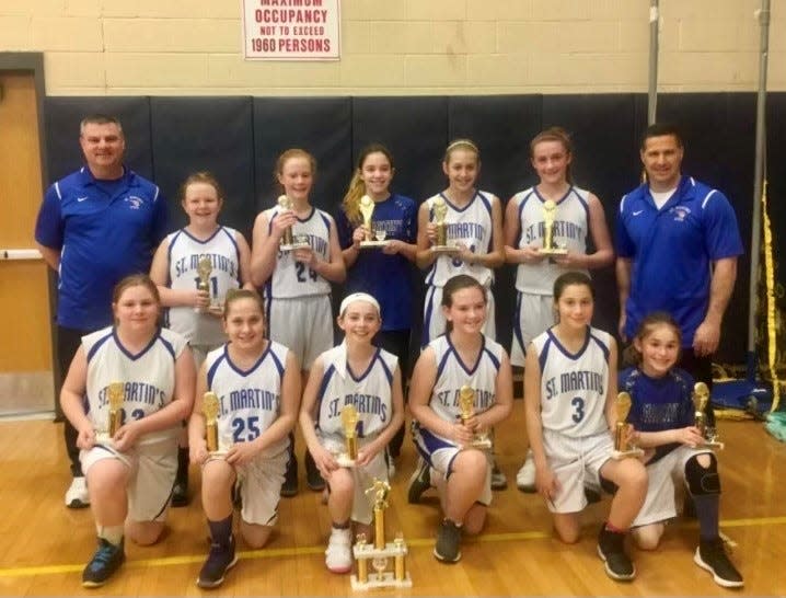 The St. Martin de Porres sixth-grade CYO girls basketball team poses with its trophies after winning its division in 2018. Simone Pelish, Blythe McQuade, Jules Belmonte and Caitlin Robertson went on to star for local high school teams.