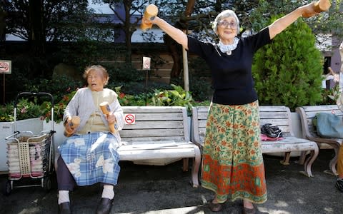 100 year-old Natsu Naruse (L) and friend during Japan's Respect for the Aged Day - Credit:  TORU HANAI