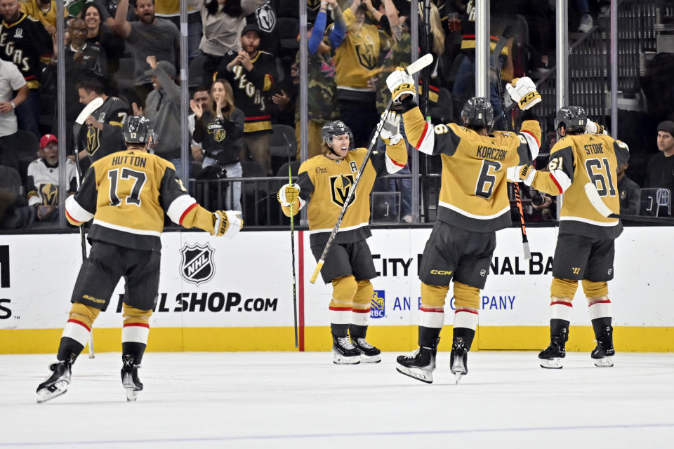 The Vegas Golden Knights celebrate center William Karlsson's (71) goal during the third period of an NHL hockey game against the Dallas Stars Tuesday, Oct. 17, 2023, in Las Vegas. (AP Photo/David Becker)