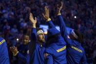 Golden State Warriors guard Klay Thompson, center left, is introduced before an NBA basketball game against the Cleveland Cavaliers in San Francisco, Sunday, Jan. 9, 2022. (AP Photo/John Hefti)