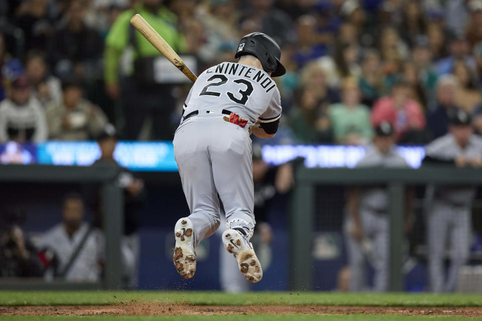 Chicago White Sox's Andrew Benintendi jumps from an inside pitch from Seattle Mariners' Bryan Woo during the fourth inning of a baseball game Friday, June 16, 2023, in Seattle. (AP Photo/John Froschauer)