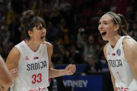 Serbia's Tina Krajisnik, left, and teammate Ivana Raca react after defeating France in their game at the women's Basketball World Cup in Sydney, Australia, Tuesday, Sept. 27, 2022. (AP Photo/Mark Baker)