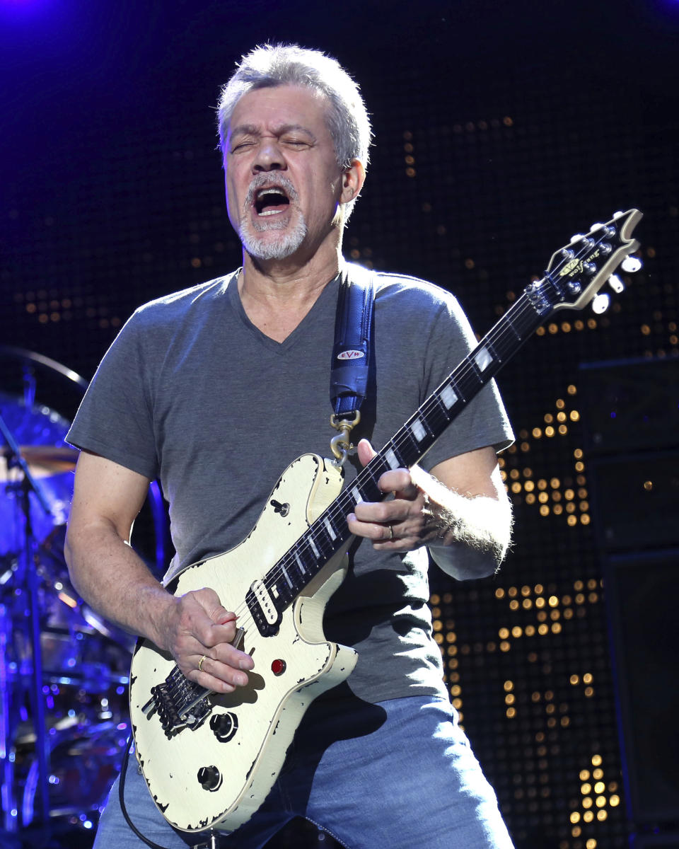 FILE - In this Aug. 13, 2015, file photo Eddie Van Halen of Van Halen performs at the Nikon at Jones Beach Theater in Wantagh, N.Y. Van Halen's Southern California hometown will memorialize the late guitar legend, but it's still unclear what form the tribute will take. The Pasadena City Council on Monday, Oct. 26, 2020, directed officials to come up with ideas and report back on how to best remember the rock icon who died of cancer Oct. 6, 2020, at age 65. (Photo by Greg Allen/Invision/AP, File)