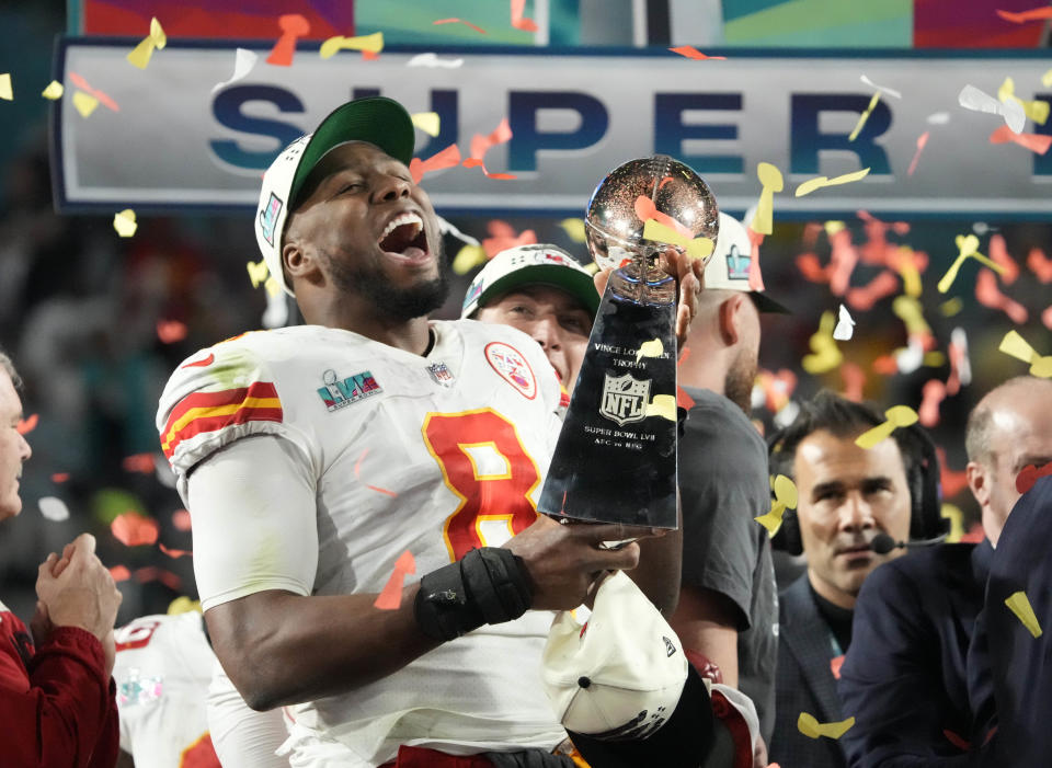 Kansas City Chiefs defensive end Carlos Dunlap celebrates with the Lombardi Trophy