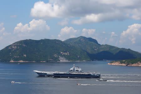 FILE PHOTO - China's aircraft carrier Liaoning sails through East Lamma Channel as it departs Hong Kong, China, July 11, 2017. REUTERS/Bobby Yip