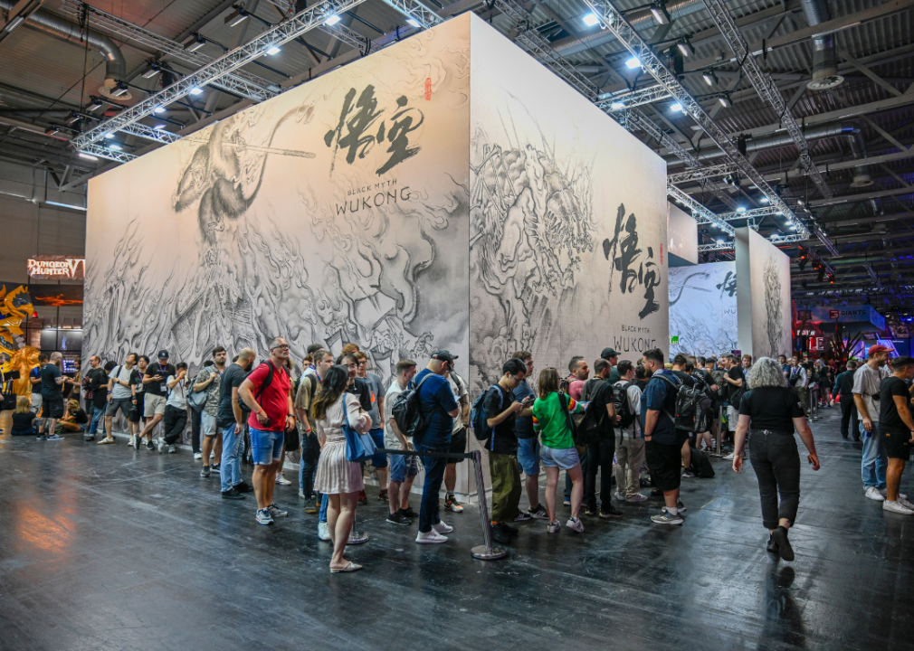 Gaming enthusiasts waiting in front of the stand for Black Myth: Wukong at a gaming fair.