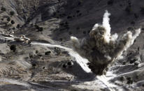 <p>U.S soldiers blow up a roadside bomb set up by Taliban fighters near the town of Walli Was in Paktika province, near the border with Pakistan, Nov. 4, 2012. (Photo: Goran Tomasevic/Reuters) </p>