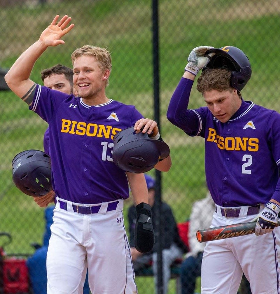 Lipscomb's Rudy Maxwell (13) and David Coppedge (2) celebrate a 13-6 win Saturday over North Alabama, which gave the Bisons a share of the Atlantic Sun West Division regular season championship.