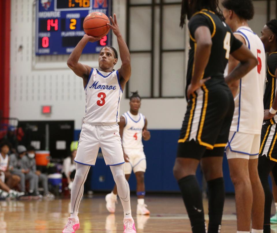 Monroe junior guard William McKinney steps to the line and sinks both ends of one-and-one foul shots against Greece Athena during their Section V boys basketball game Monday, Dec. 18, 2023 at James Monroe High School in Rochester.