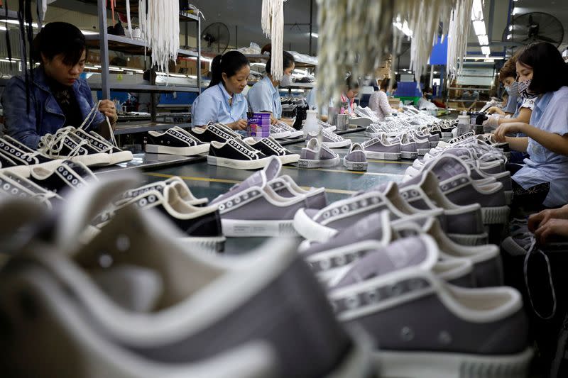FILE PHOTO: The making of shoes for export at a factory in Hanoi