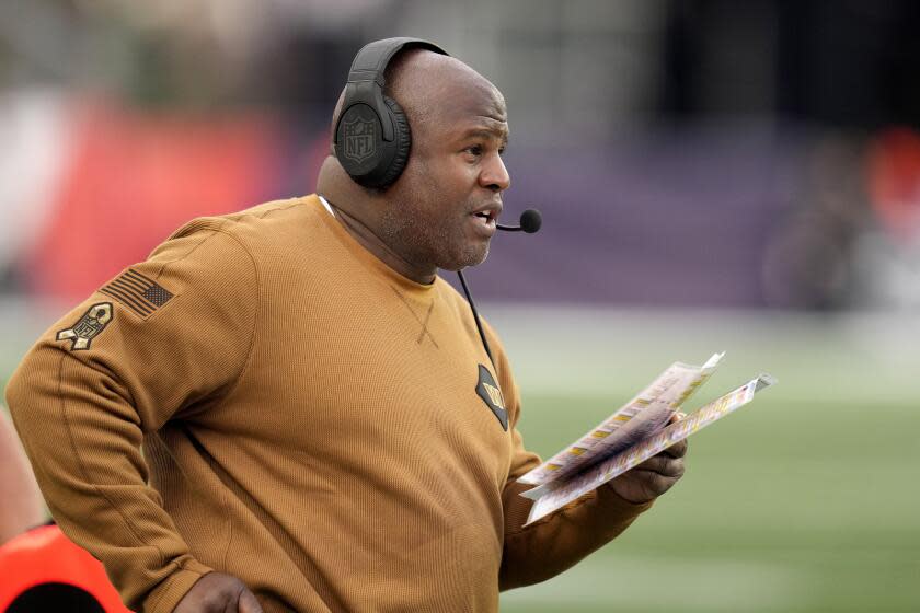 Washington Commanders offensive coordinator Eric Bieniemy watches from the sideline.