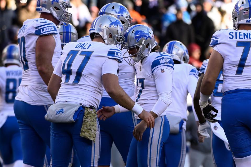 Nov 13, 2022; Chicago, Illinois, USA;  Detroit Lions place kicker Michael Badgley (17) celebrates with Detroit Lions long snapper Scott Daly (47) after he makes an extra point against the Chicago Bears during the second half at Soldier Field. Mandatory Credit: Matt Marton-USA TODAY Sports