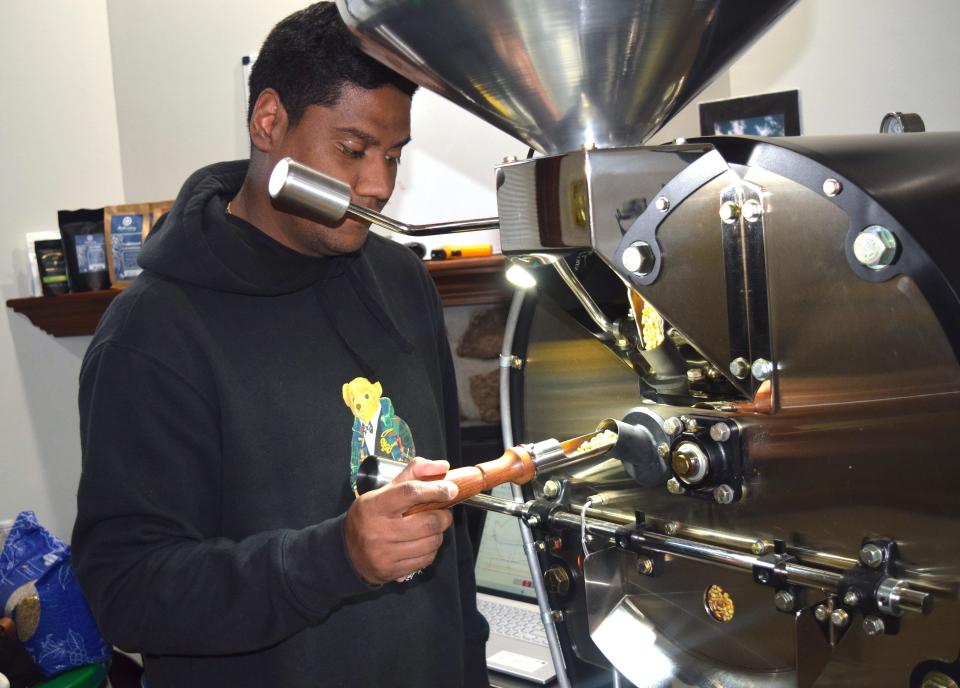 Sebastian Sanchez inspects a batch of imported coffee beans being roasted at Millersburg Coffee Company. "We bring green specialty coffee straight from in the skilled hands of the local farmers we know personally in Colombia," he says.