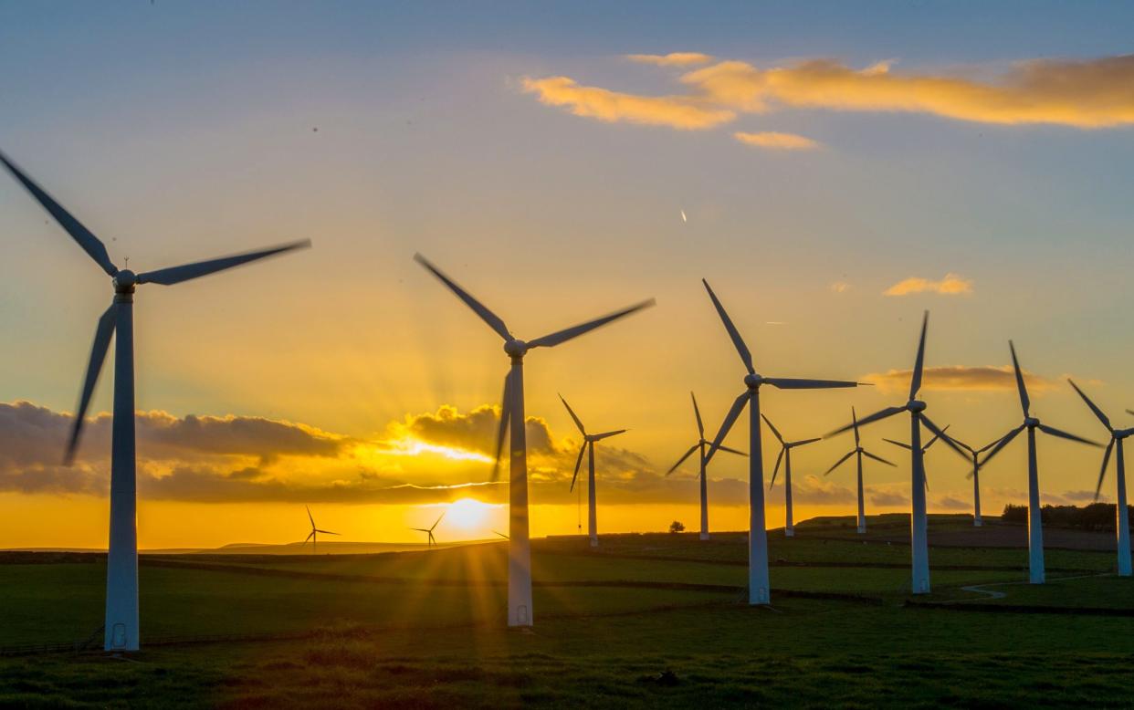 Wind Turbine in the Sunset Wind Turbines at Royds Farm, Yorkshire - Copyright (c) 2015 Rex Features. No use without permission.