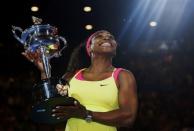 Serena Williams of the U.S. poses with her trophy after defeating Maria Sharapova of Russia in their women's singles final match at the Australian Open 2015 tennis tournament in Melbourne January 31, 2015. REUTERS/Issei Kato