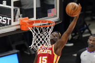 Atlanta Hawks center Clint Capela goes to the basket during the second half of the team's NBA basketball game against the Utah Jazz Friday, Jan. 15, 2021, in Salt Lake City. (AP Photo/Rick Bowmer)