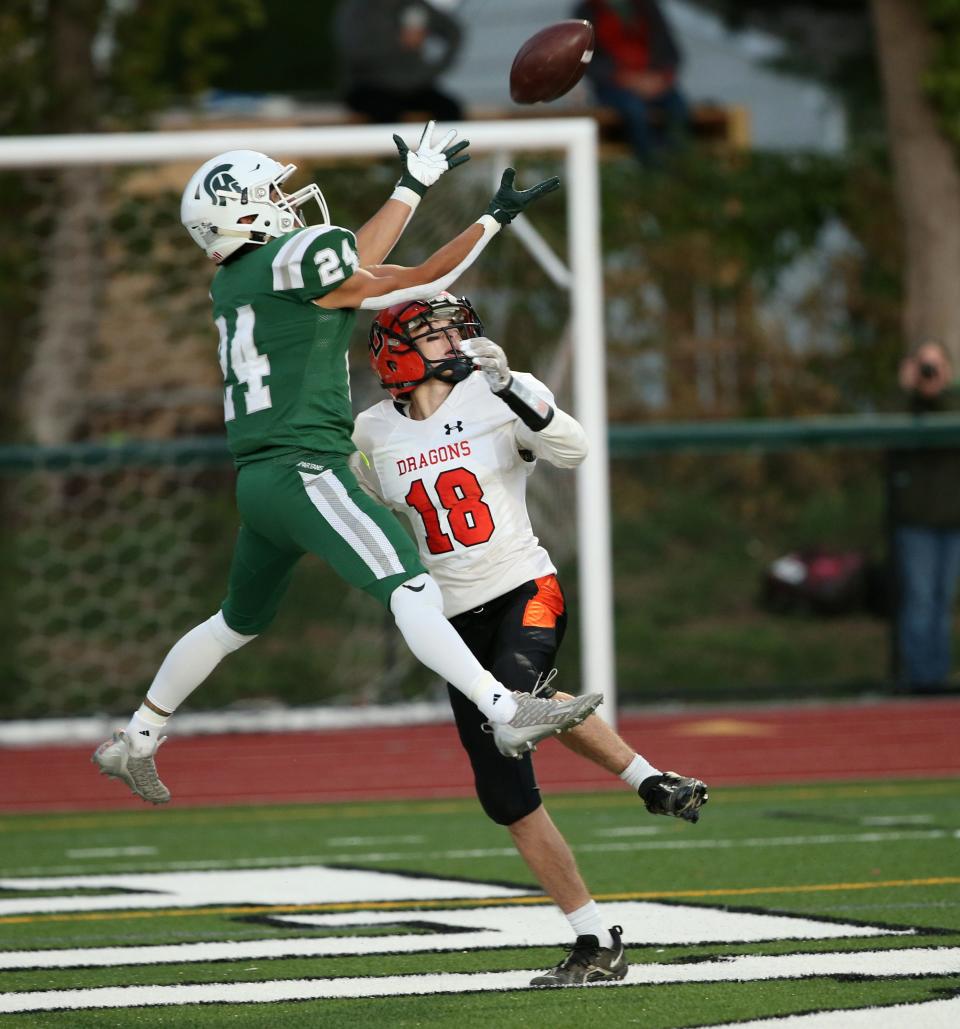 Spackenkill's Steven Ciancio leaps for a pass as Dover's Caden Sciacca covers him during Friday's game in the Town of Poughkeepsie on September 23, 2022. 