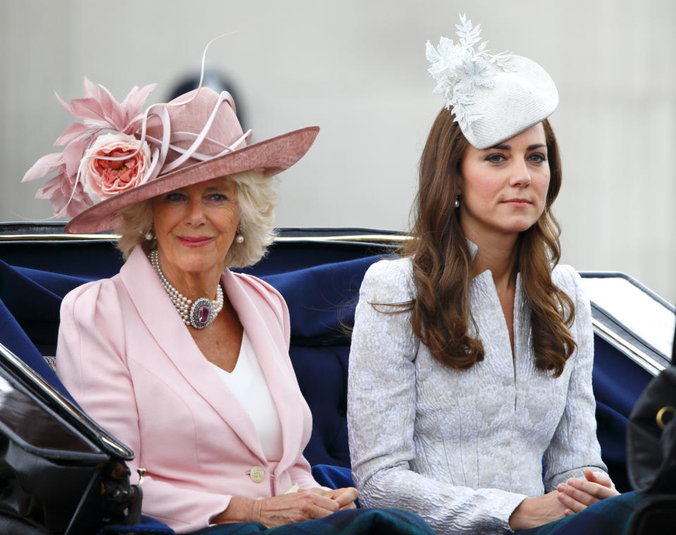 Camilla, Duchess of Cornwall, and Catherine, Duchess of Cambridge, travel down The Mall in a horse-drawn carriage during Queen Elizabeth II's Birthday Parade on June 14, 2014, in London.