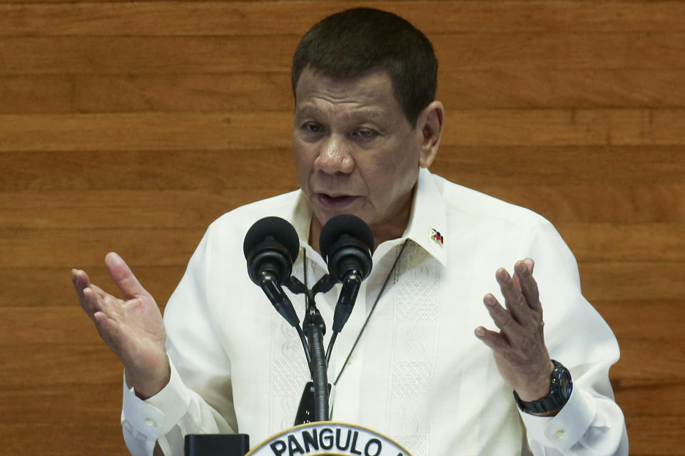 FILE - In this July 27, 2020, file photo provided by the Malacanang Presidential Photographers Division, Philippine President Rodrigo Duterte gestures as he delivers his State of the Nation Address (SONA) at the House of Representative in Metro Manila, Philippines. Duterte has expressed helplessness in the face of China’s seizure of Philippine-claimed territories in the South China Sea. (Simeon Celi Jr./Malacanang Presidential Photographers Division via AP)