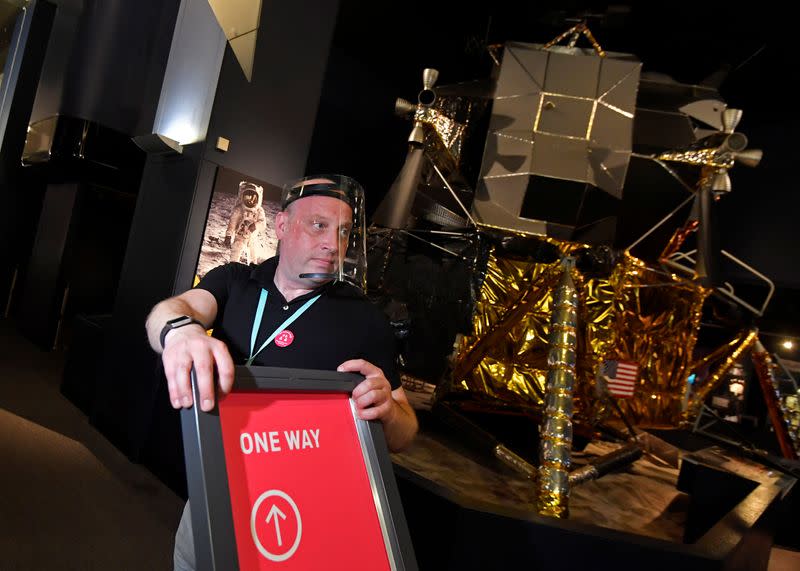 Staff prepare ahead of the reopening of the Science Museum, in London, Britain