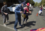 People of all ages dance to Jerusalema in Johannesburg, Sunday, Sept. 6, 2020. South Africans of all walks of life are dancing to the rousing anthem, which has sparked a global trend, to lift their spirits amid the battle against COVID-19. (AP Photo/Denis Farrell)