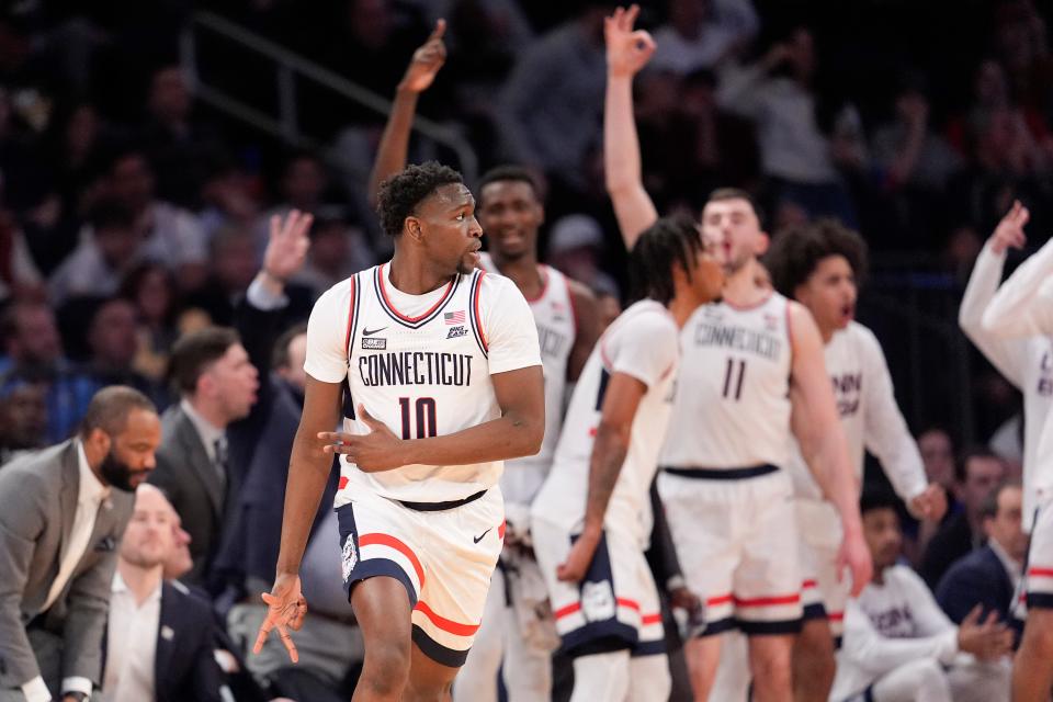 UConn guard Hassan Diarra (10) reacts after scoring a 3-point basket against St. John's during the second half of an NCAA college basketball game in the semifinals of the Big East men's tournament Friday, March 15, 2024, in New York. UConn won 95-90. (AP Photo/Mary Altaffer) ORG XMIT: MSG515