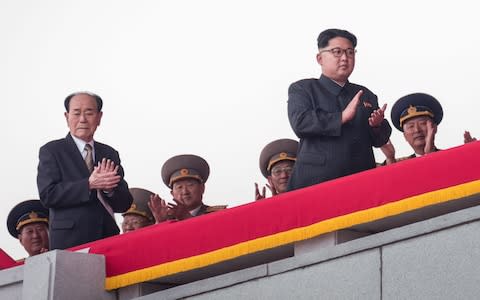 North Korean leader Kim Jong-un, right, followed by Kim Yong-nam  - Credit:  ED JONES Source: AFP/ ED JONES