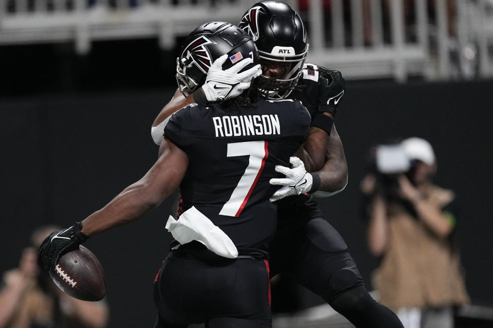 Atlanta Falcons running back Bijan Robinson (7) celebrates his touchdown during the first half of an NFL football game against the Carolina Panthers, Sunday, Sept. 10, 2023, in Atlanta. (AP Photo/John Bazemore)