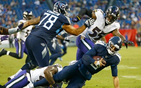 Tennessee Titans quarterback Marcus Mariota (8) is sacked by Baltimore Ravens linebacker Patrick Onwuasor for a 7-yard loss - Credit: (AP Photo/Wade Payne)