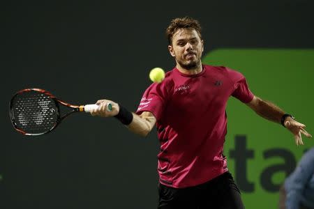 Mar 27, 2017; Miami, FL, USA; Stan Wawrinka of Switzerland hits a forehand against Malek Jaziri of Tunisia (not pictured) on day seven of the 2017 Miami Open at Crandon Park Tennis Center. Wawrinka won 6-3, 6-4. Mandatory Credit: Geoff Burke-USA TODAY Sports