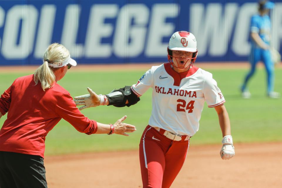 Day 5: Oklahoma's Jayda Coleman celebrates with Sooners head coach Patty Gasso after leading off the bottom of the first with a home run.