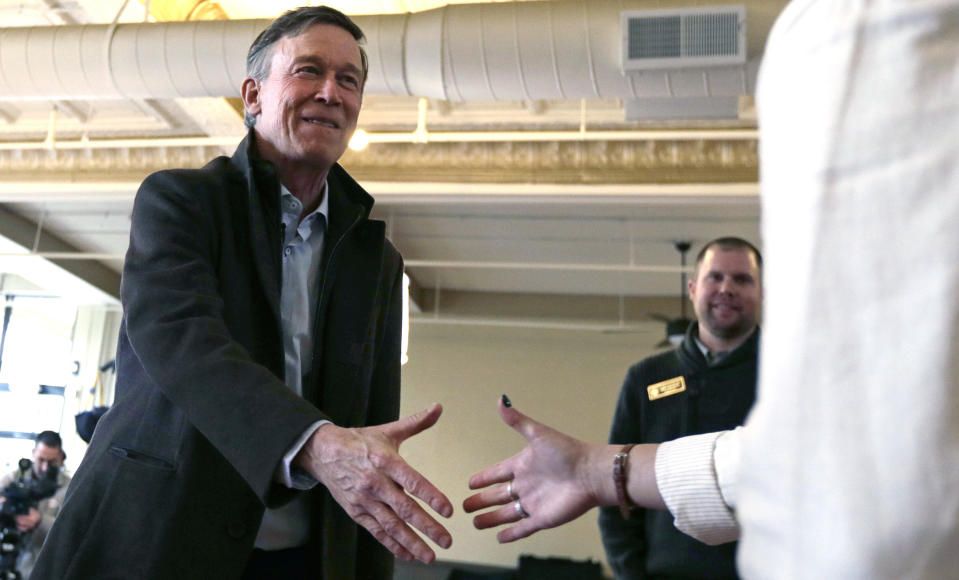 Former Democratic Colorado Governor John Hickenlooper shakes hands while meeting with AmeriCorps members at a roundtable campaign stop in Manchester, N.H., Friday, March 22, 2019. Hickenlooper joined the 2020 Presidential race earlier in the month. (AP Photo/Charles Krupa)