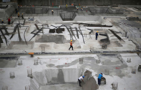 People work at a construction site in Beijing, China July 20, 2017. Picture taken July 20, 2017. REUTERS/Jason Lee