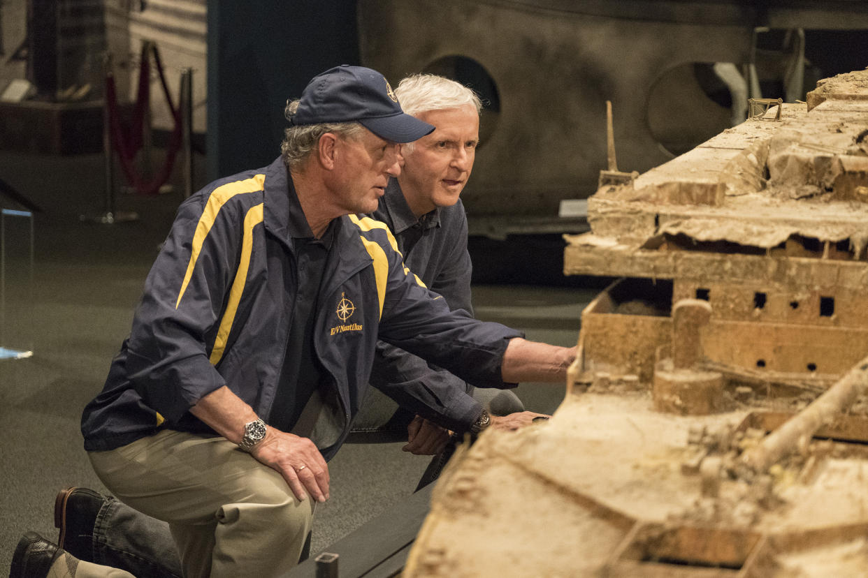 Oceanographer Bob Ballard and James Cameron study a scale model of the RMS Titanic in the documentary <em>Titanic: 20 Years Later With James Cameron</em>. (Photo: National Geographic/Mark Fellman)