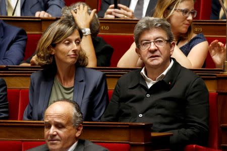 Newly-elected members of parliament Emmanuelle Menard (L) of France's far-right National Front (FN) political party and Jean-Luc Melenchon (R) of La France Insoumise political party (France Unbowed) attend the opening session of the French National Assembly in Paris, France, June 27, 2017. REUTERS/Charles Platiau